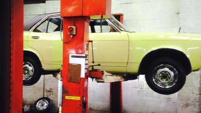 yellow car being repaired